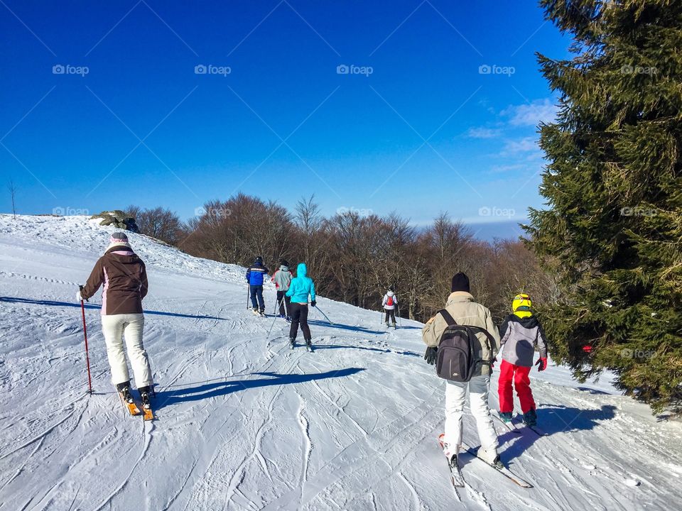 Group of people skiing on the slope