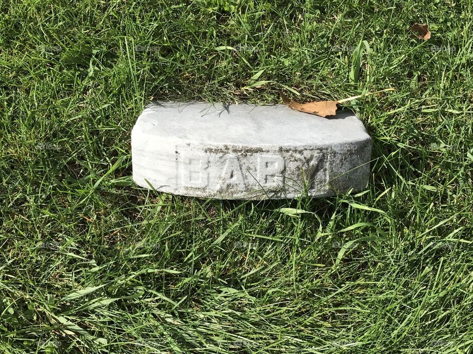 Knocked over headstone that only says BABY