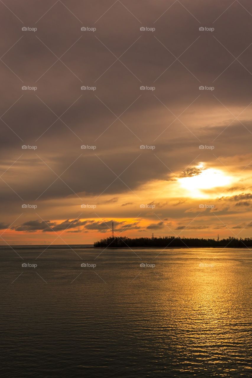 Sunset at sea with reflection