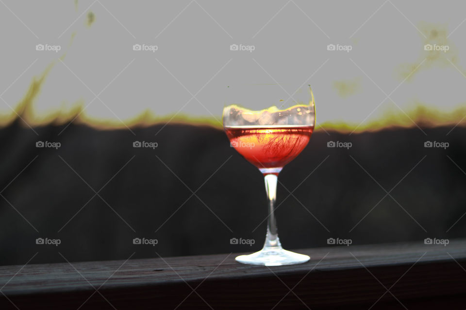 wine on the deck as sun sets