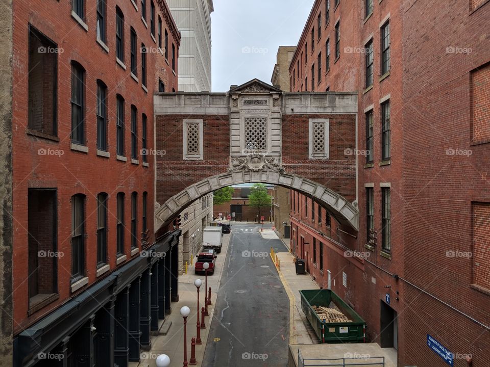 Bridging the divide. Two industrial brick buildings brought together with an ornate brick bridge walkway.