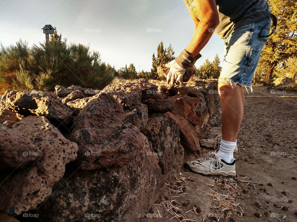 Building a rock wall fence