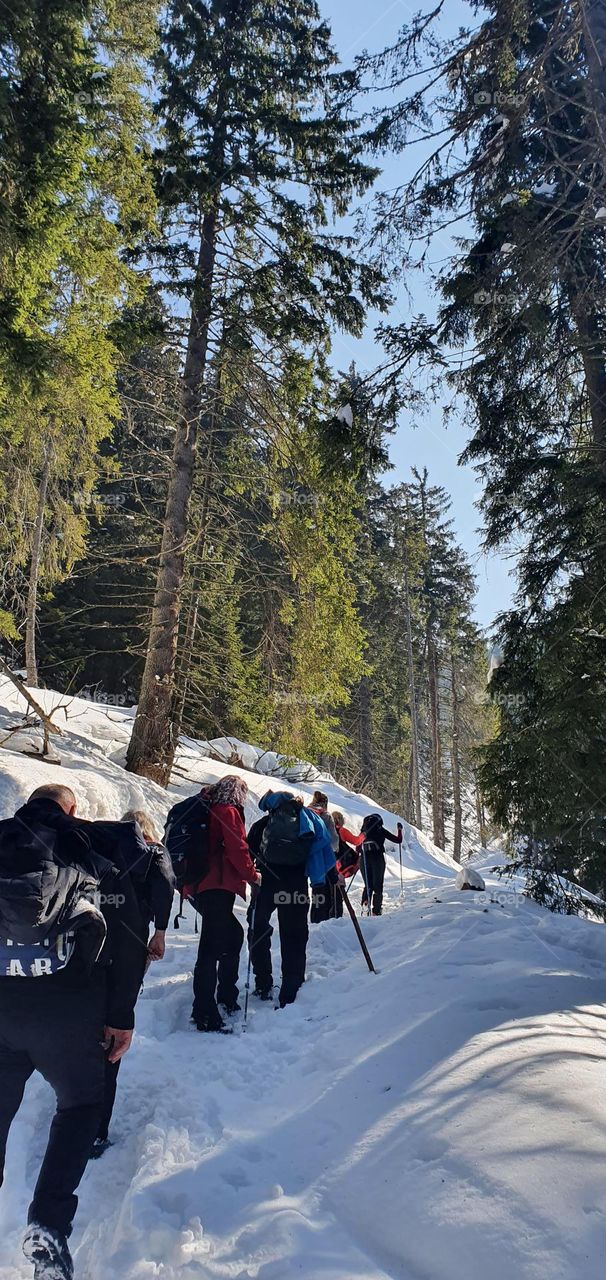 Winter climbing on the snow, enjoying of fresh air and sunny day