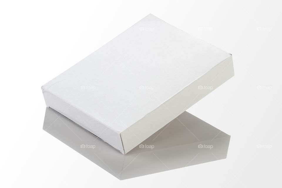 Blank white box on white reflective background