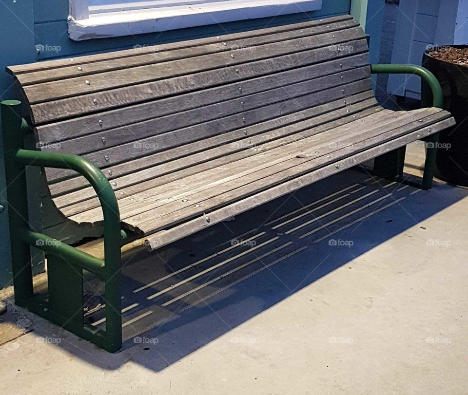 This seat at night, waiting to have some one take a rest and be seated. on the streets of Wellington.NZ.