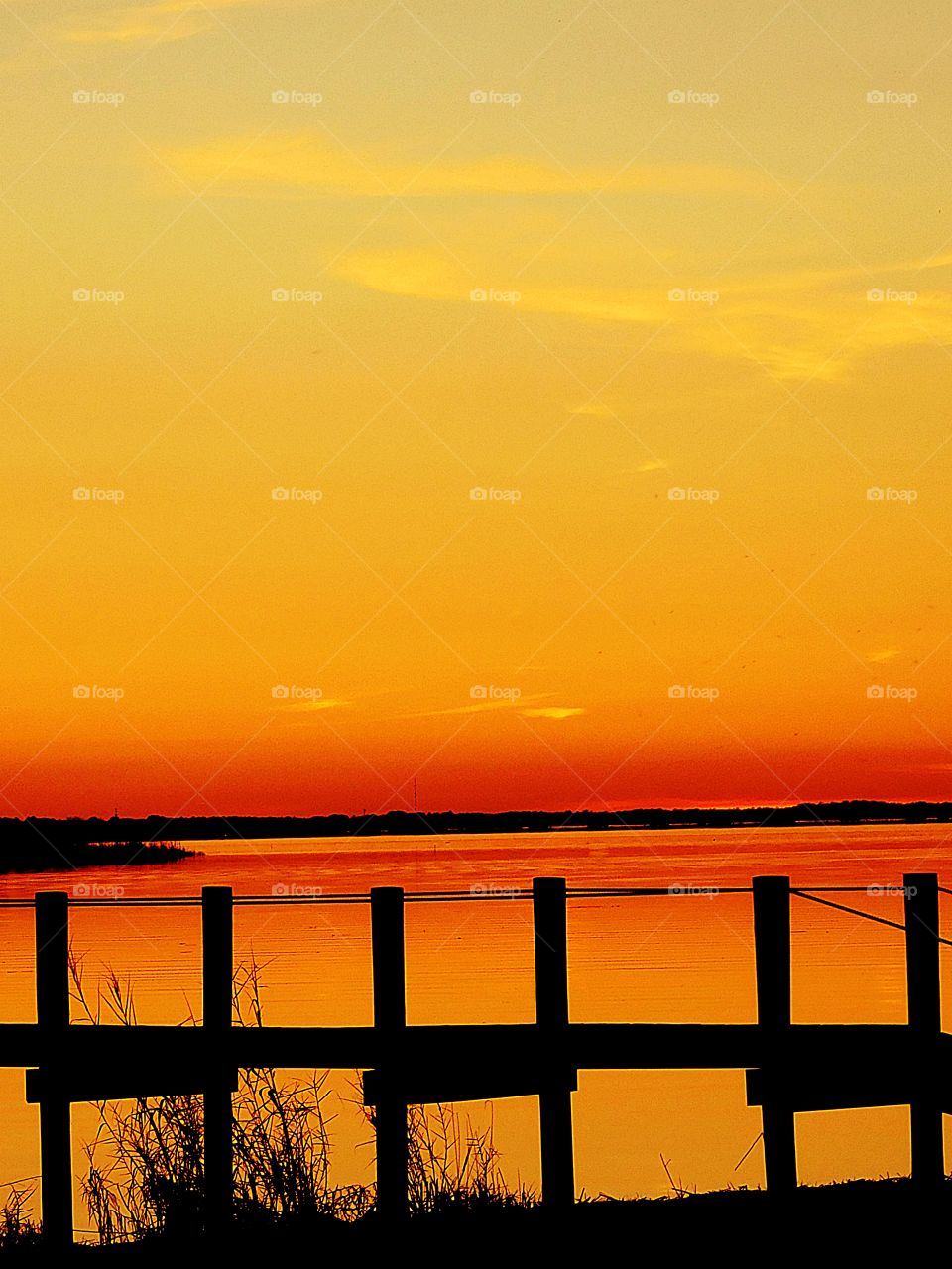Sunset descending reflecting over the bay