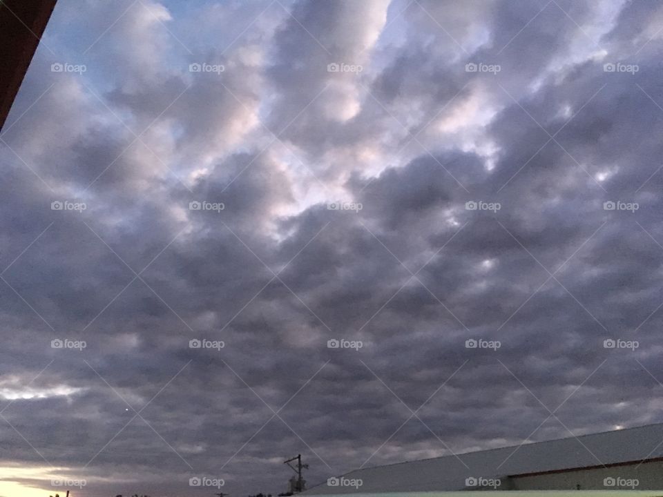 Wonderful clouds wonderful sky. A stormy night ahead! Looking like puffs of black smoke.