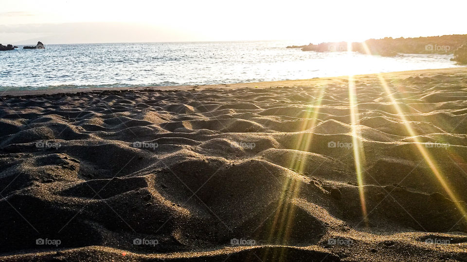 sunset beams on sand