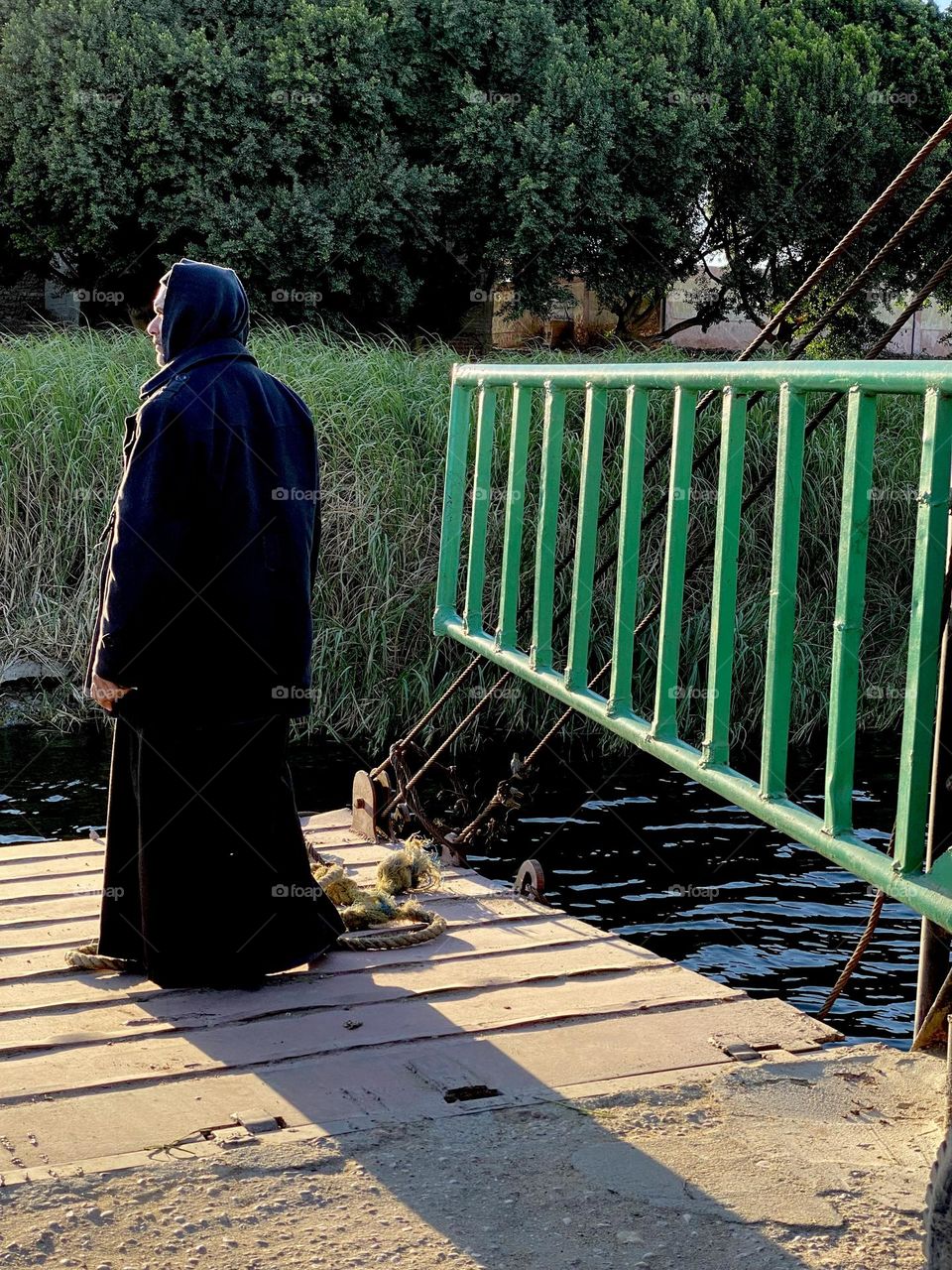 A man is waiting until the ship stands so he can leave it safely 