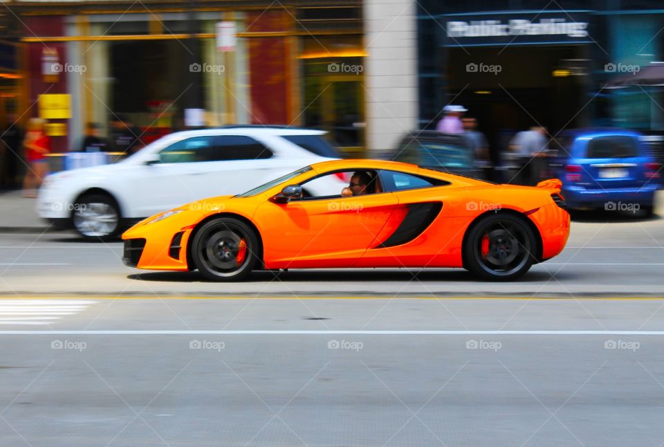 McLaren. A vibrant orange McLaren in the streets of Chicago 