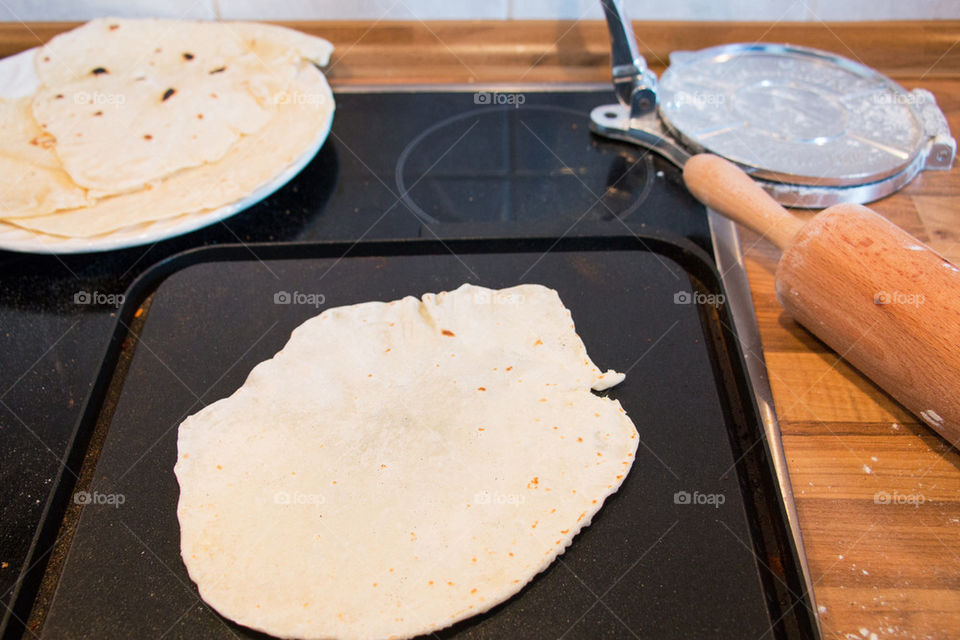 Baking and rolling tortillas 