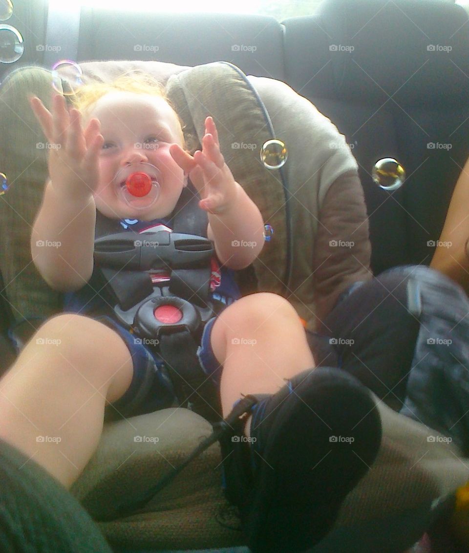 wee bubbles. my grandson being occupied on our way to dinner about a 35 minute trip