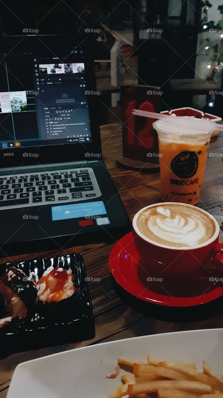 A cup of latte to accompany the work.