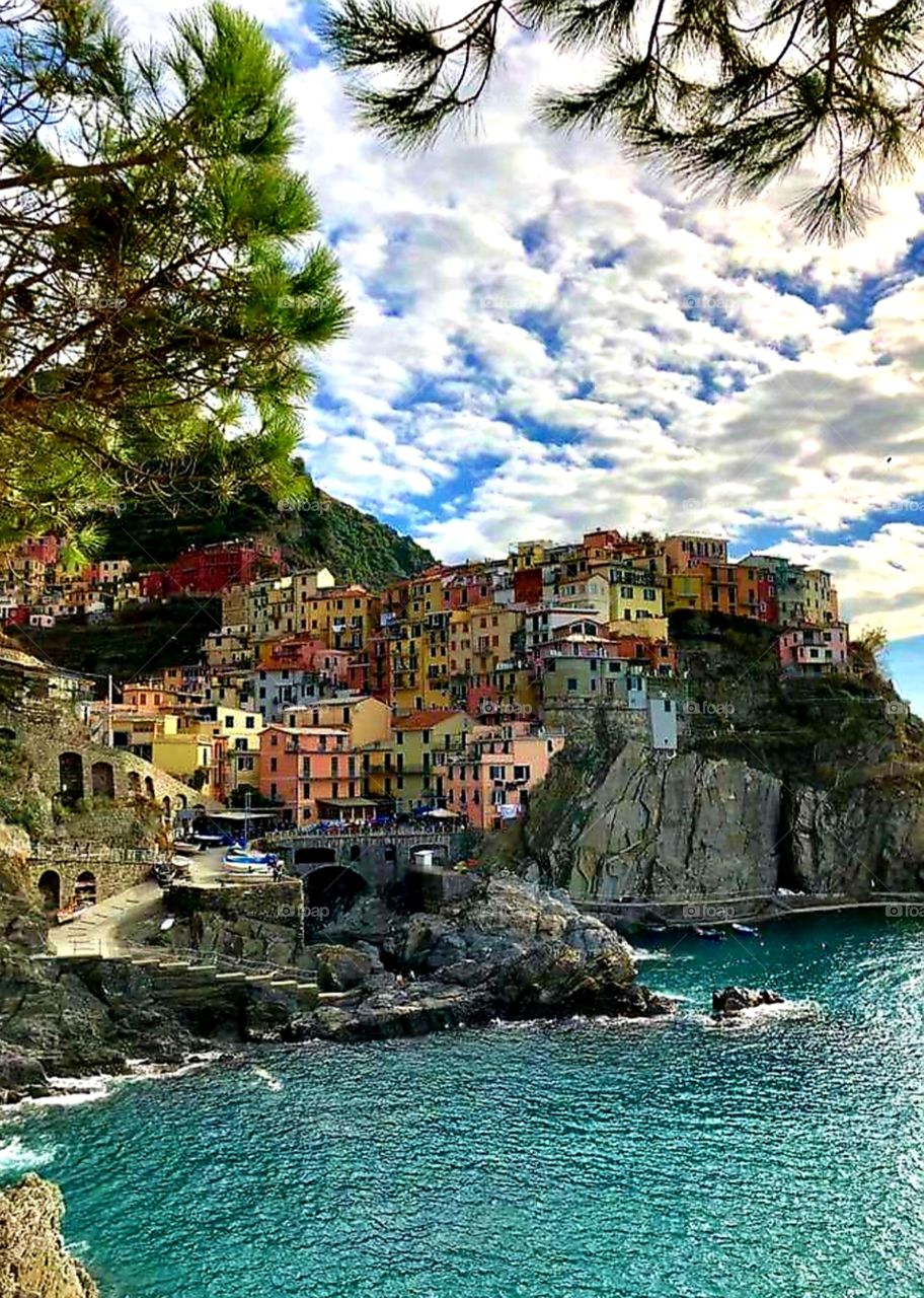 Colorful Cinque Terre on the Italian Coast brightly beckons visitors