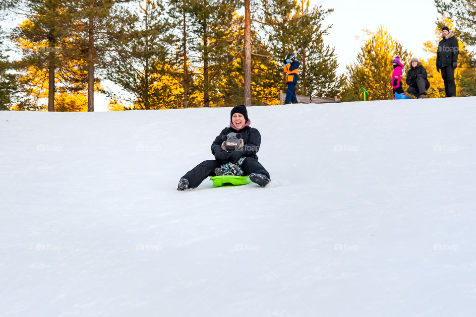 Family fun on sledge.