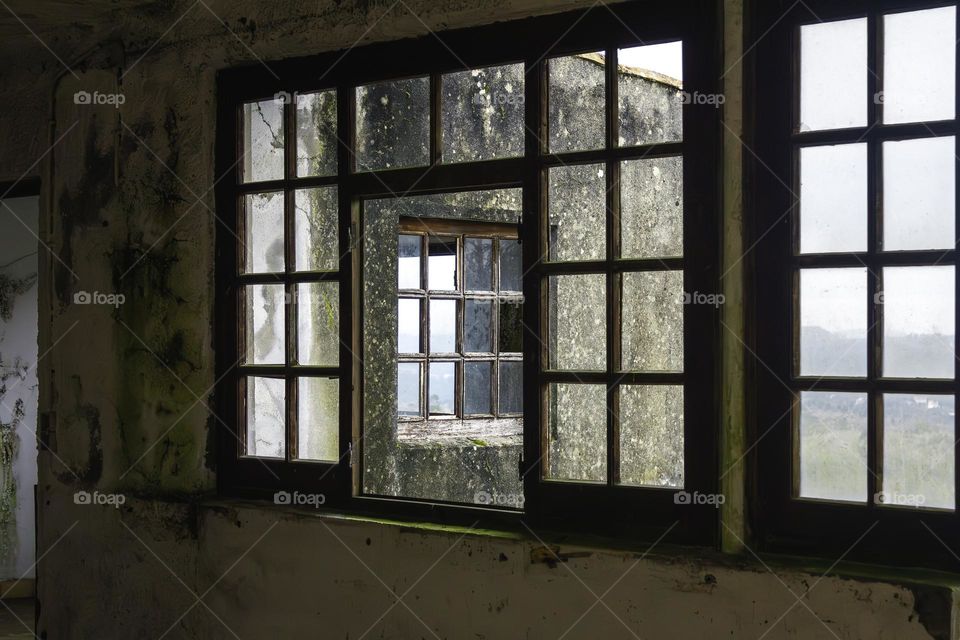 Old wooden windows on an abandoned property