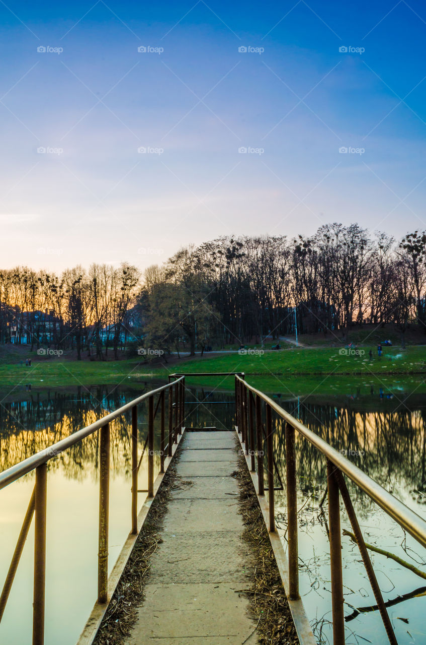 city park with lake in the spring season