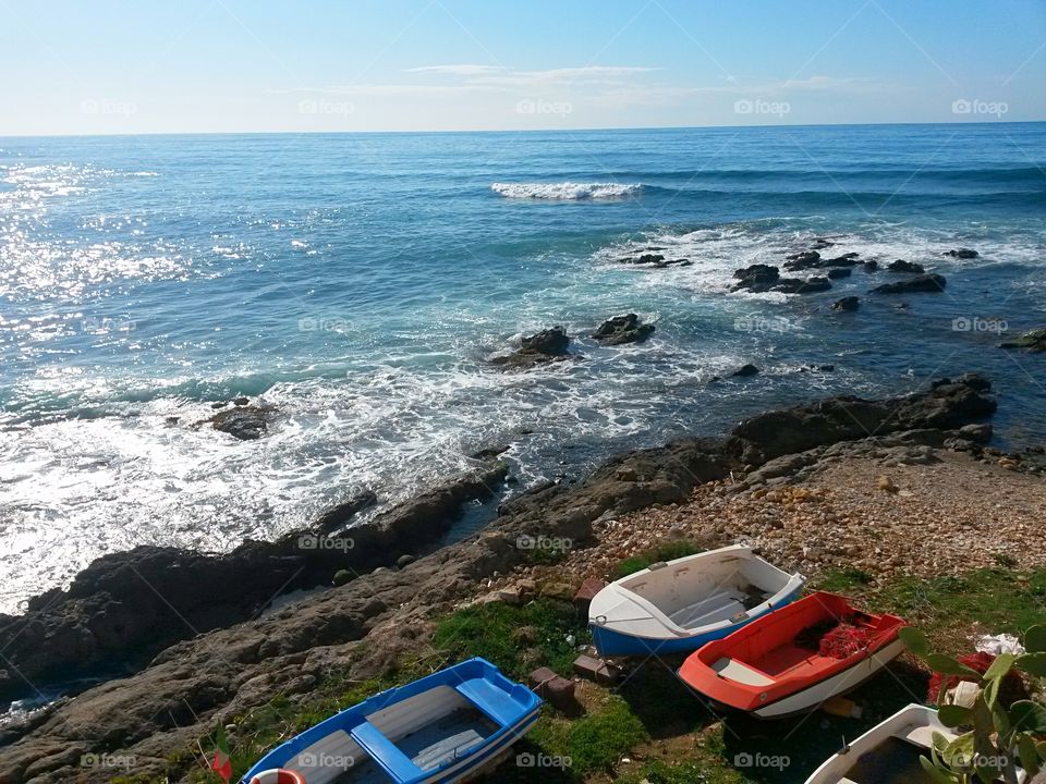 scenic view of mediterranean sea coast with some boat in North sardinia