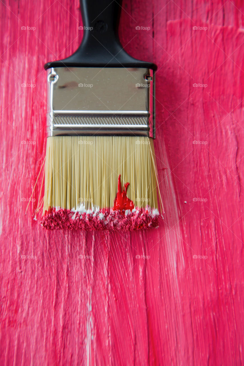 Close-up of paint brush with pink color