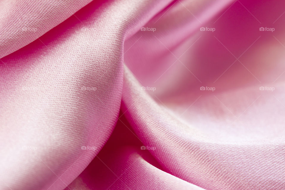 Satin Luxury Cloth Texture Can Use As Abstract Holidays. Abstract design background. Smooth Elegant Shiny Pink Silk