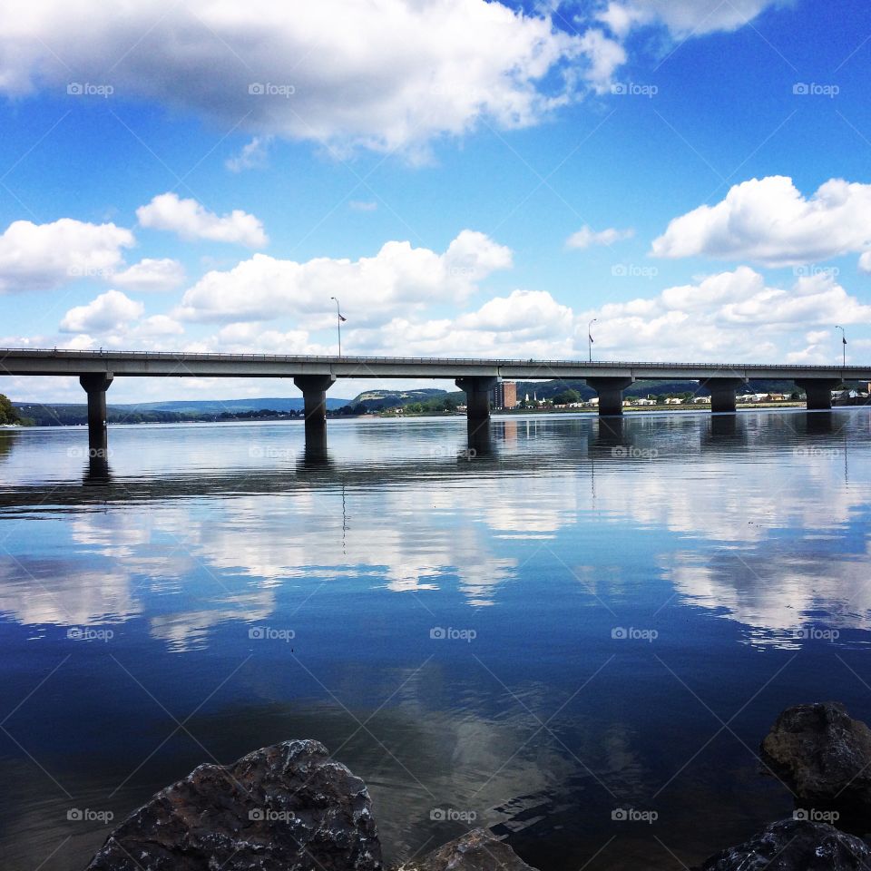 Reflection. Reflection of the sky in water of the Sunbury Bridge.