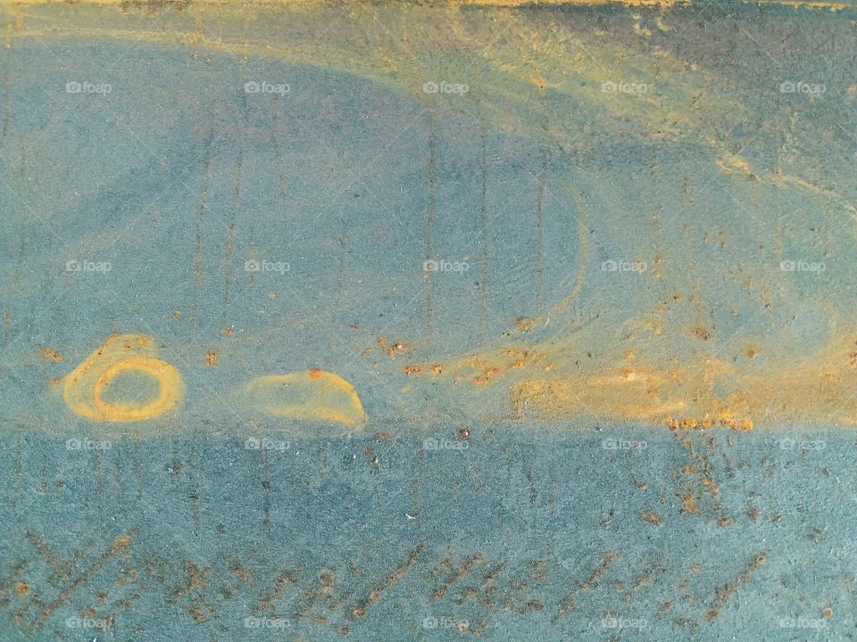 Rusty island on steel