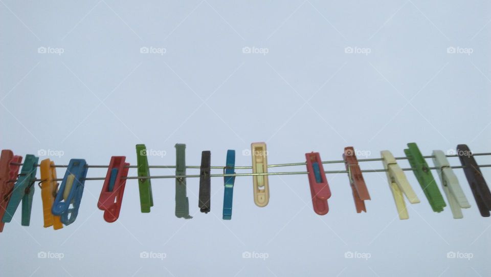 Colored handles hanging in wires.