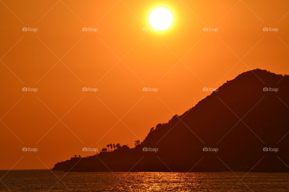 Silhouette of mountain during sunset