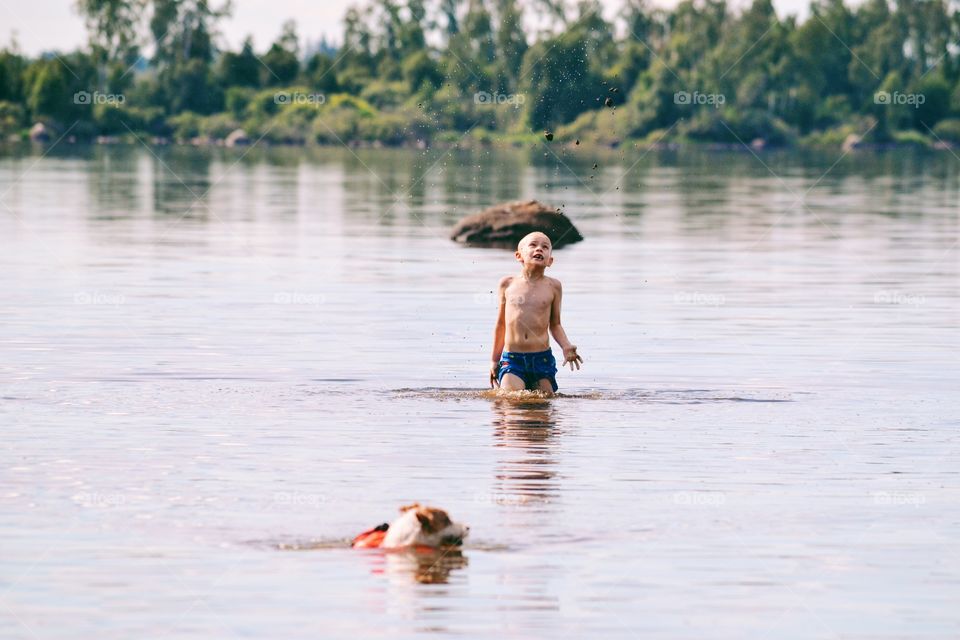 Boy bathing in the lake