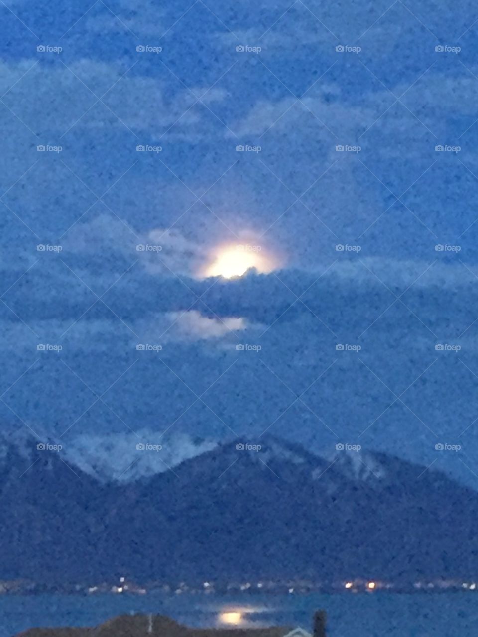 Moon through Clouds over Mountain 