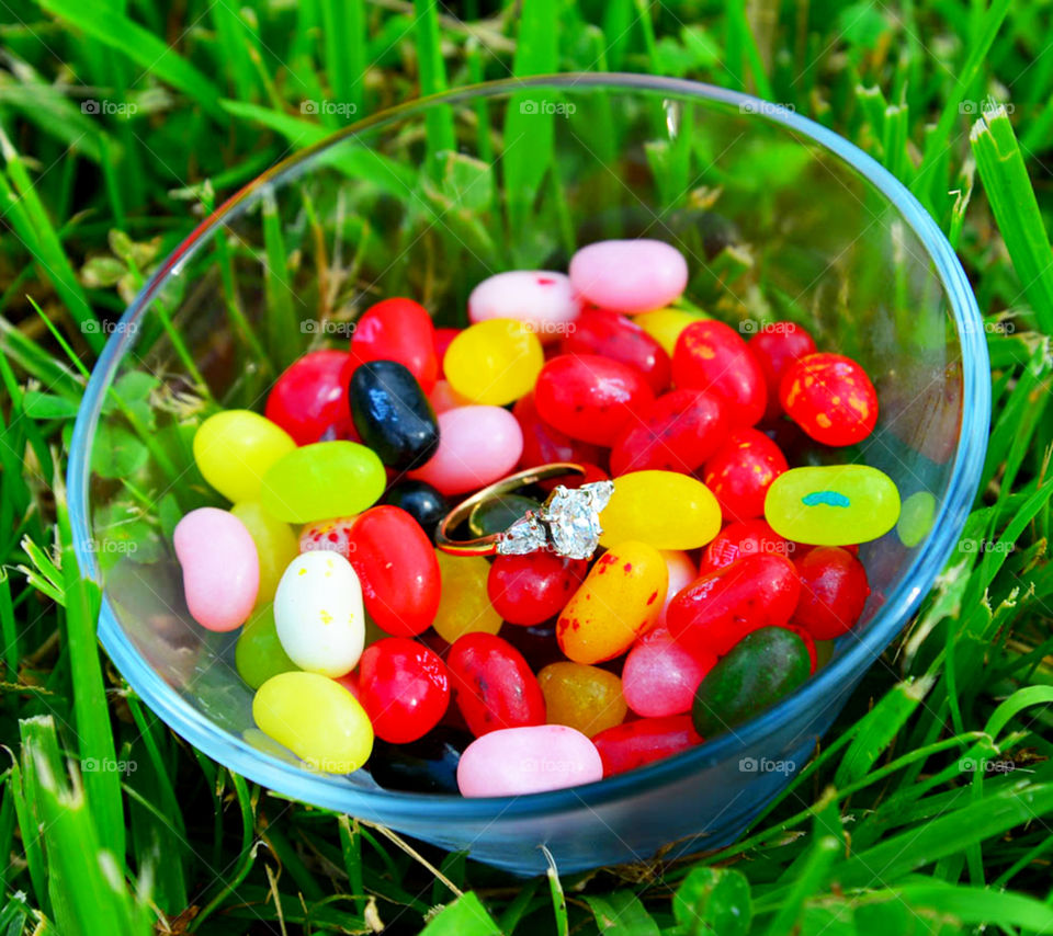 engagement ring. engagement ring hidden in bowl jelly beans