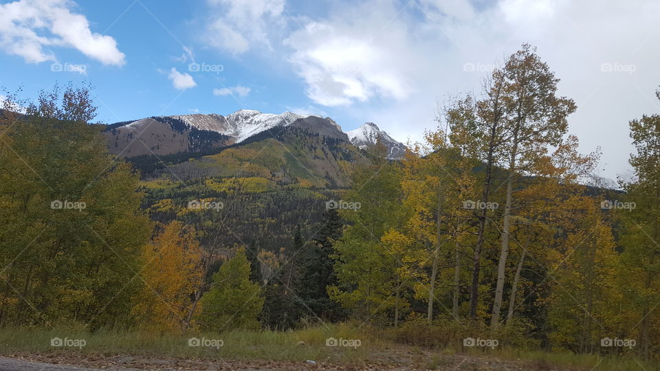 on the drive to telluride, beautiful snow
y mountains atop the change of fall to winter