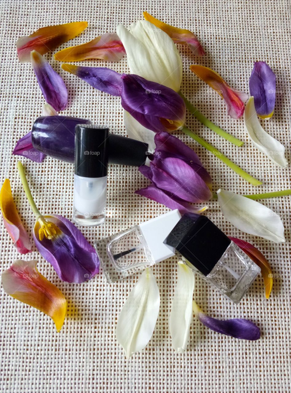 nail lacquers and tulips petals