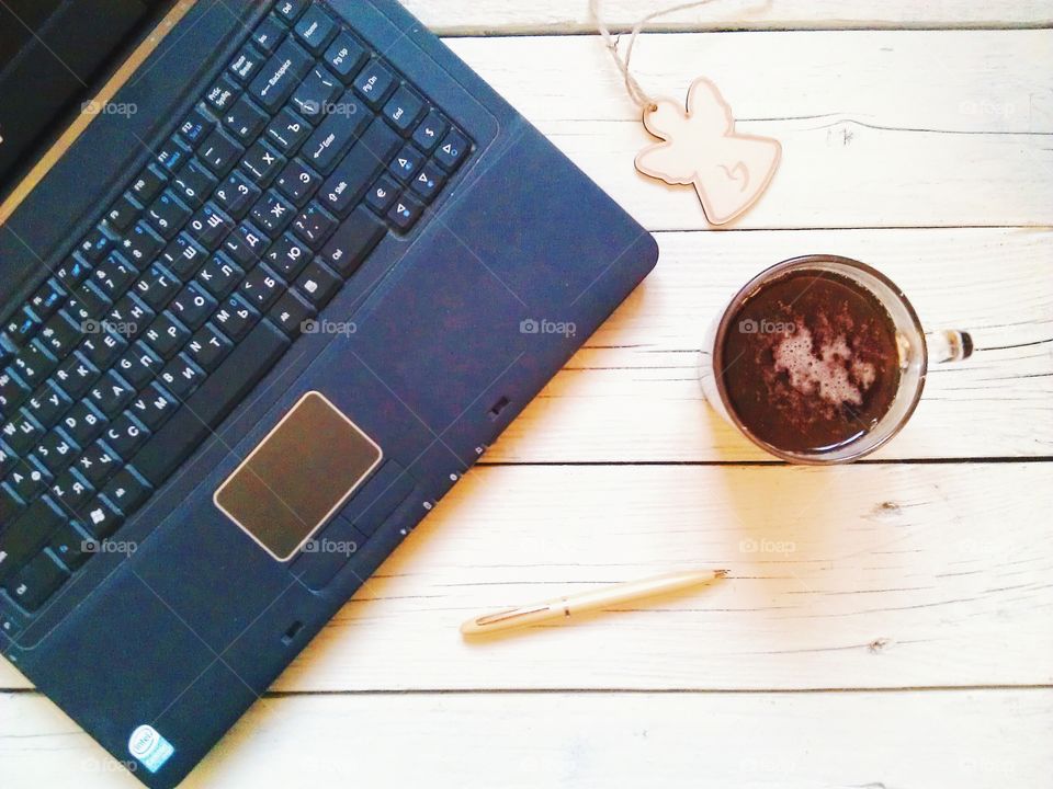 notebook, pen, organizer, a cup of tea on the desktop