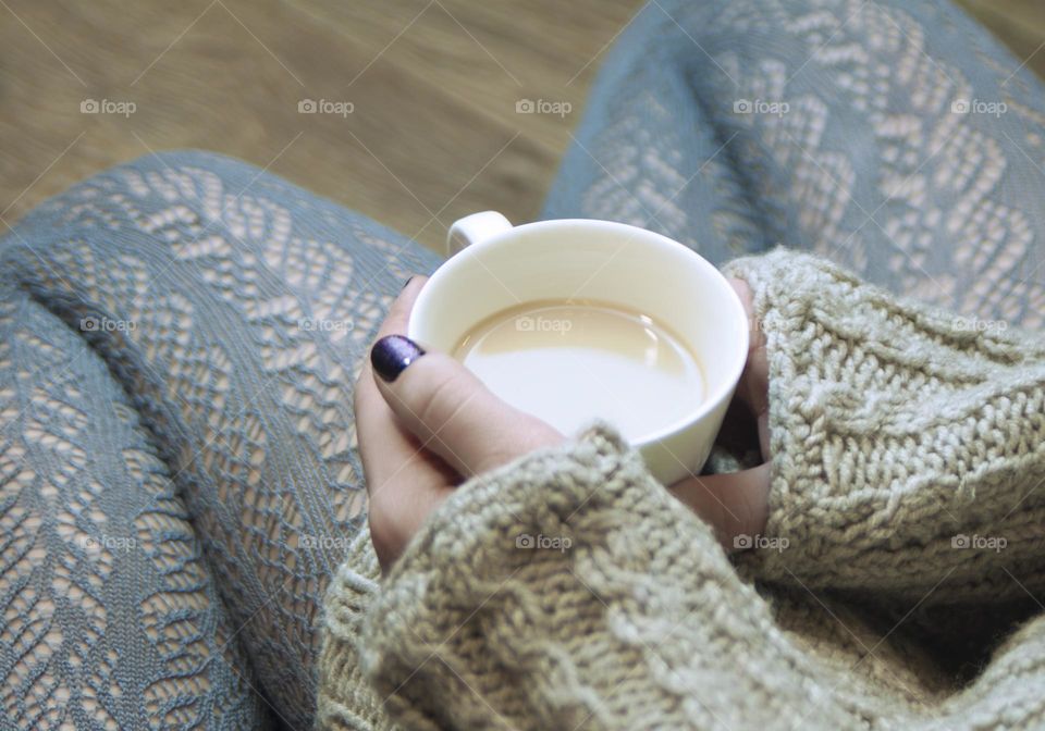 girl holding a cup