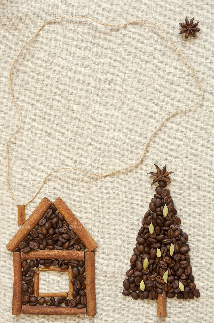 Christmas tree and house made from coffee beans