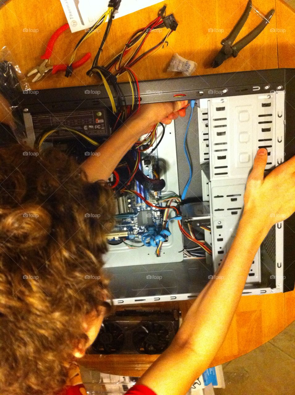 A 14 year old boy builds his first PC on his own. 