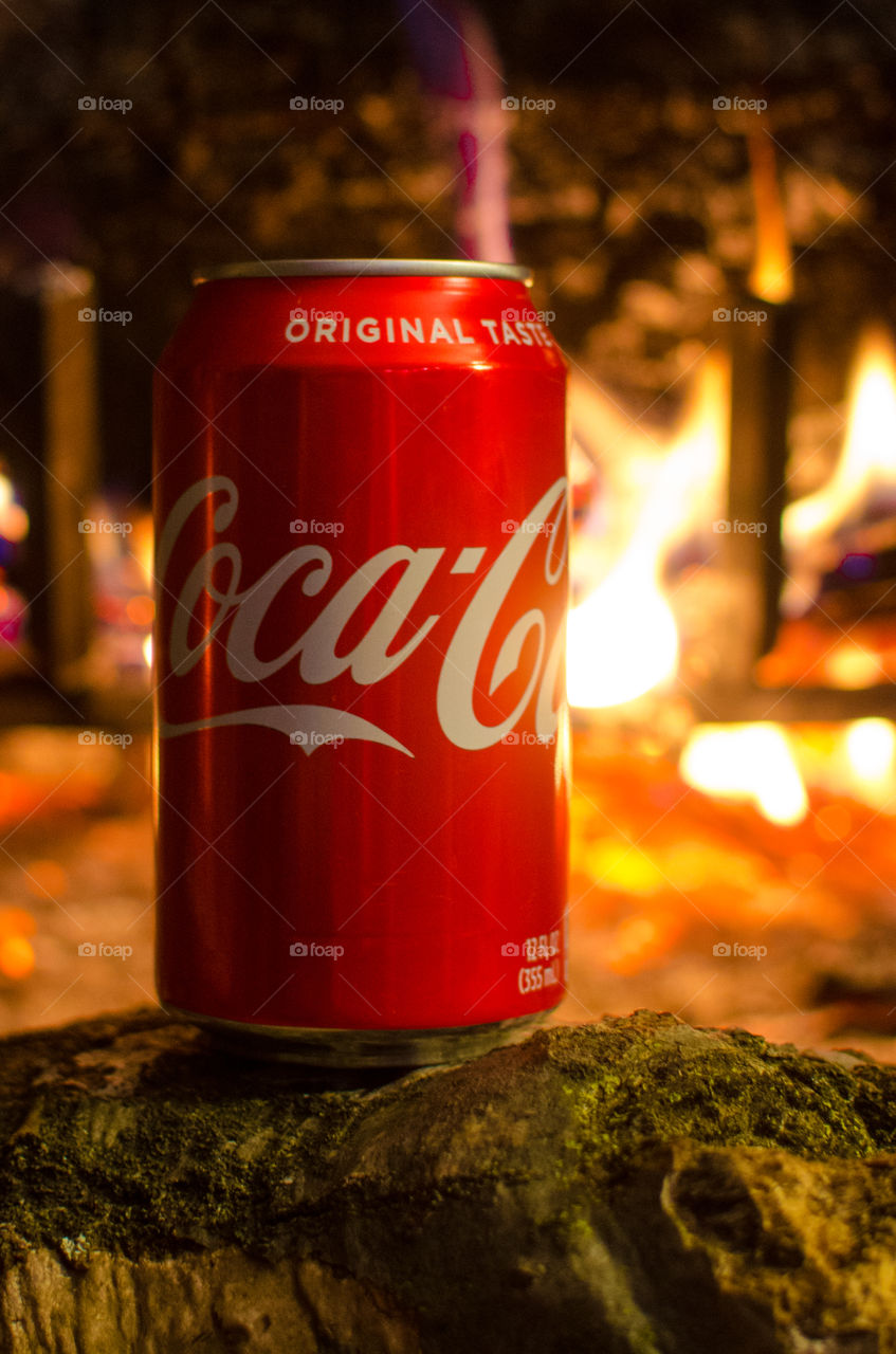 Enjoy a nice Coca-Cola in front of a warm fire