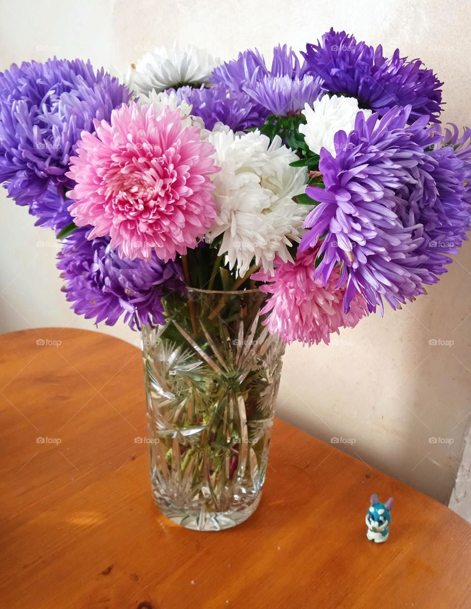 vase with asters on the table beautiful