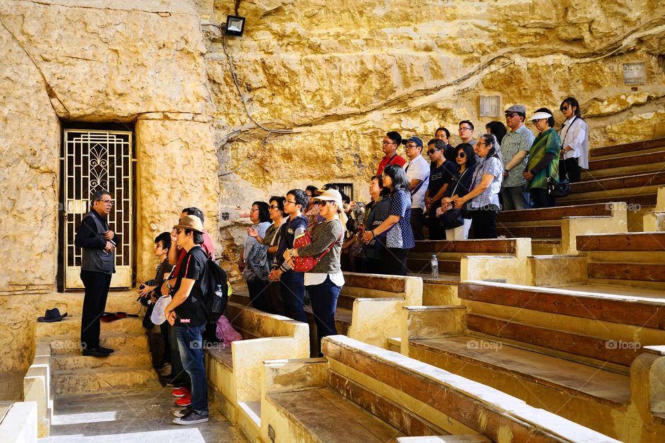 a sermon for group of tourists in the Church of Simon the Tanner in Cairo of Egypt