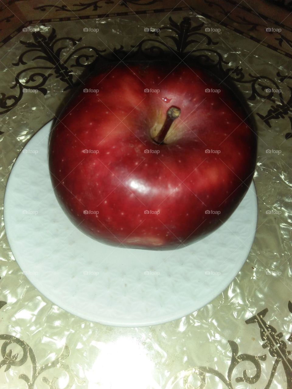 Beautiful red apple in a plate