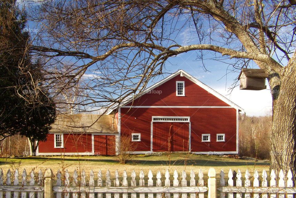Quintessential red barn with Picketfence