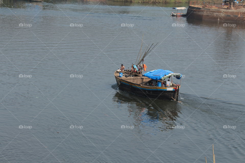 Journey for earning....The boat on its way with its crew for fishing to sell in market....