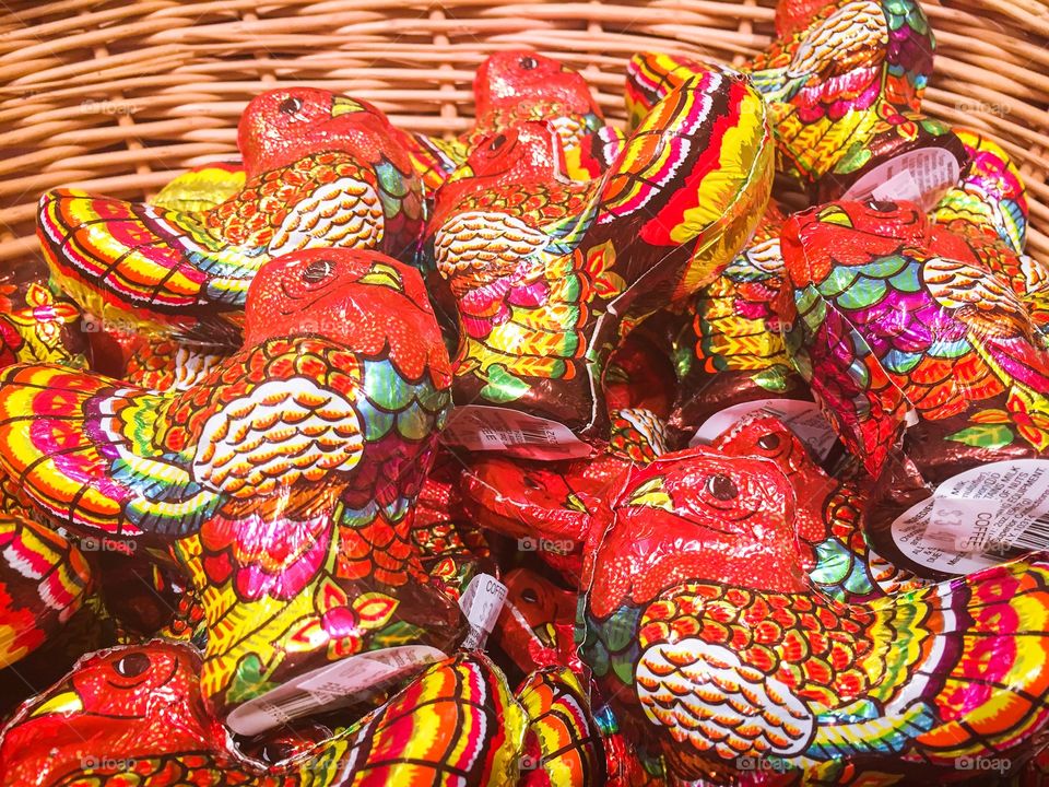 Candy. A basket of colorful foil wrapped chocolate  Thanksgiving Turkeys. 