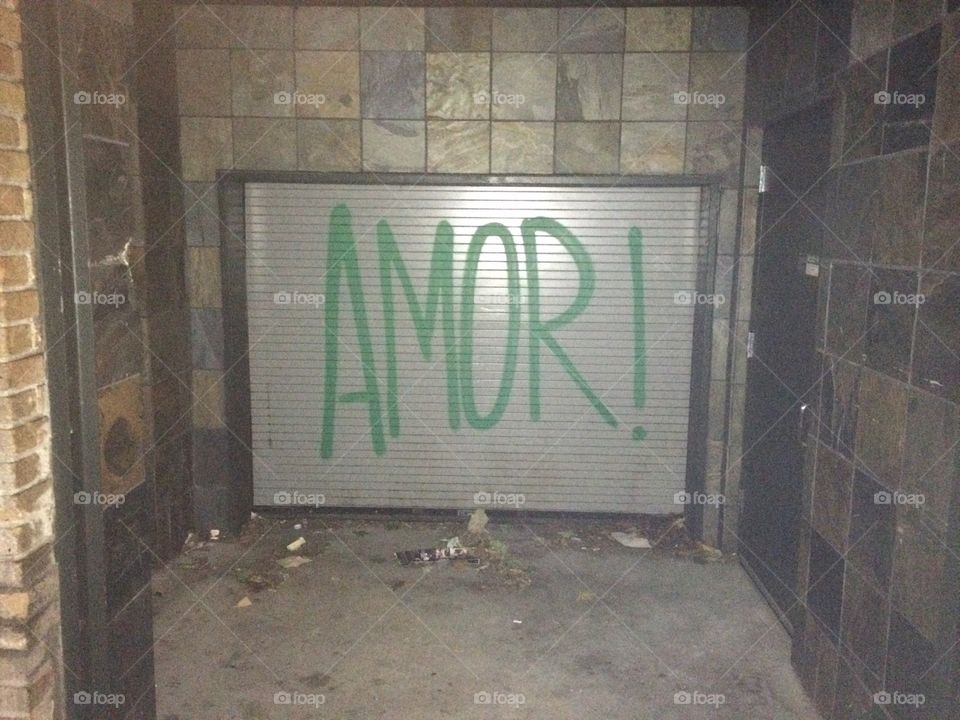 Graffiti in a city that says Amor; which means love in Spanish.