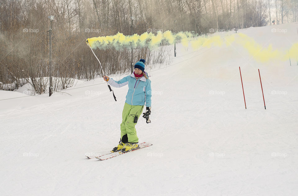 Mature woman sliding in the snow