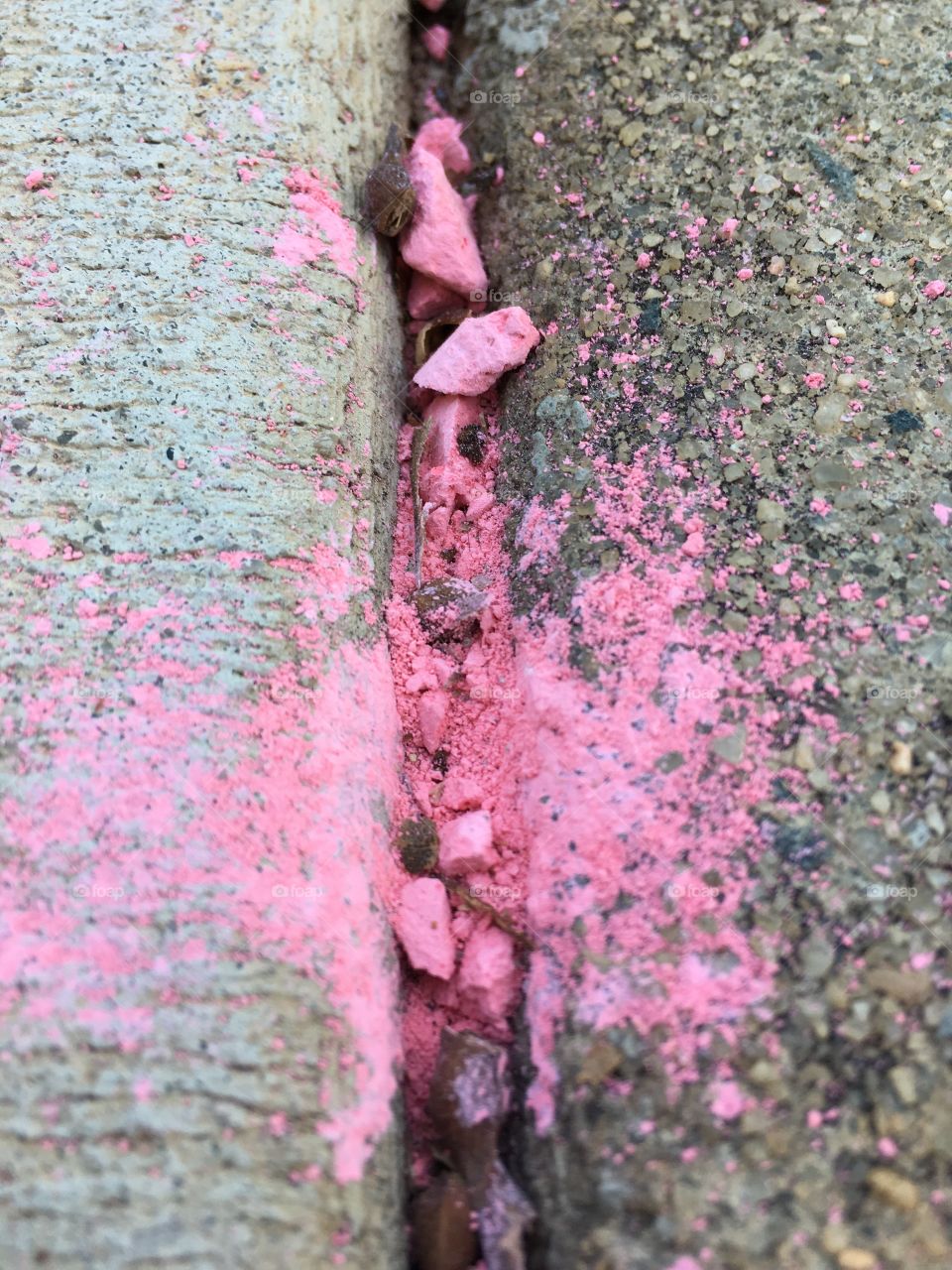 Crumbled pink sidewalk chalk 