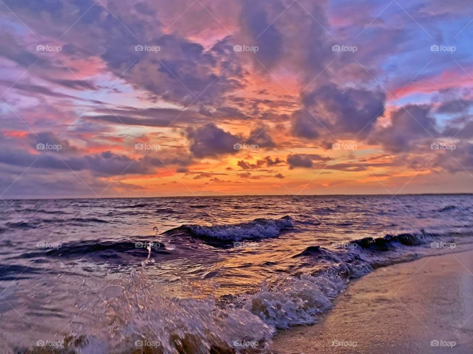 
Gorgeous orange, pink and blue hues leave spectators in awe as the sun makes its way toward the horizon