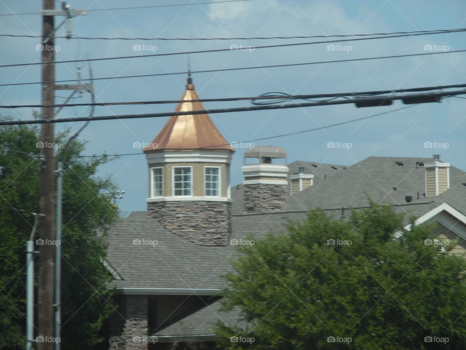 golden steeple. This is a picture of a neat looking roof that I saw while on vacation in the Gulf of Mexico. 👣 🚶 🏃 🔥 💨