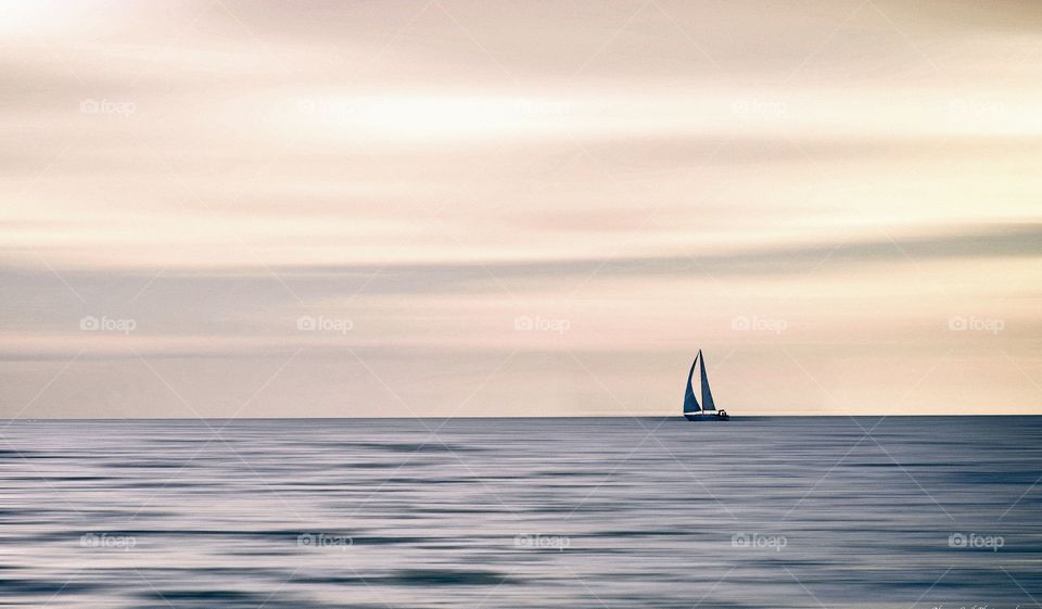 Distant view of sailboat on sea